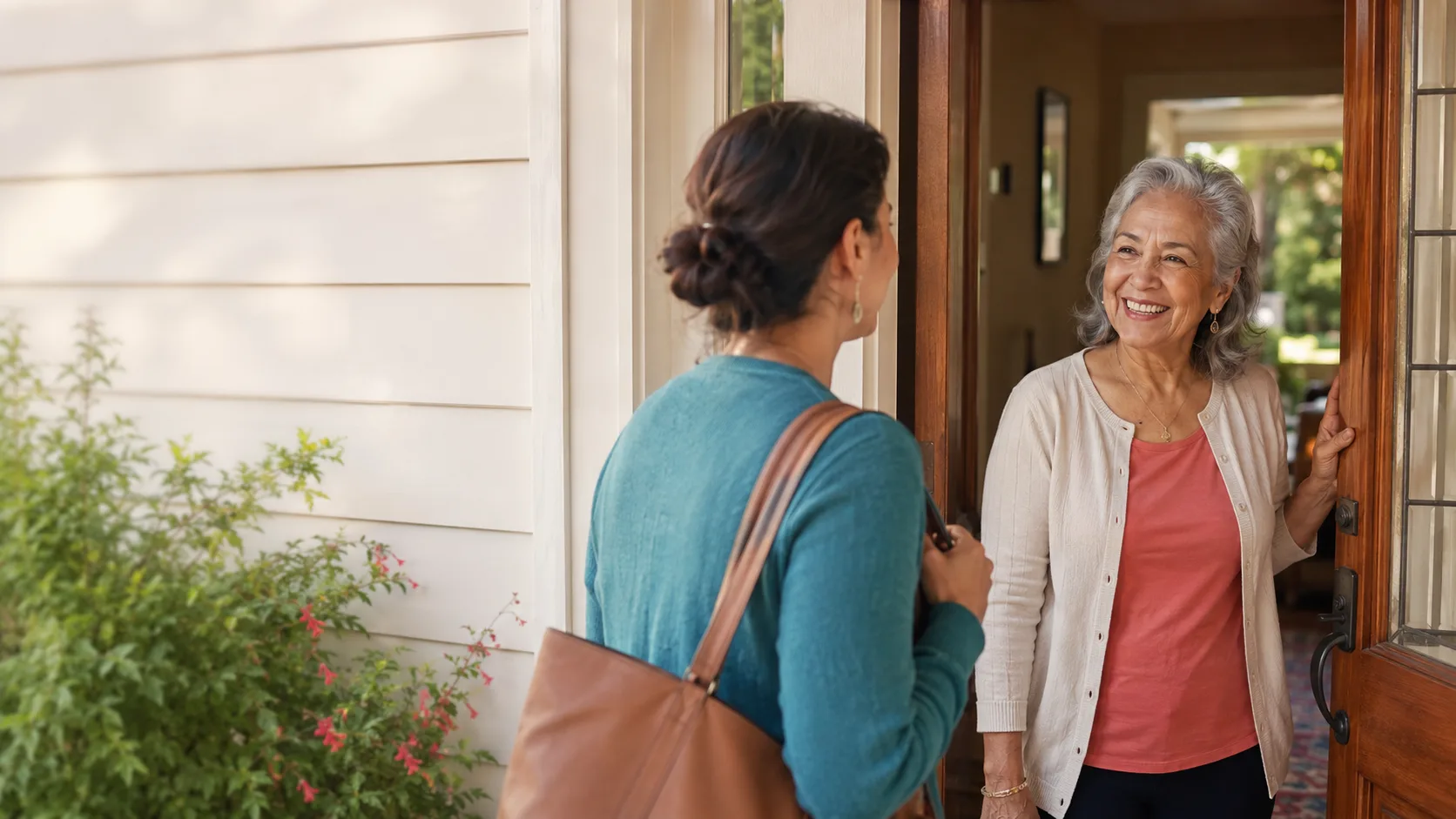 A caregiver arriving and being welcomed at the front door